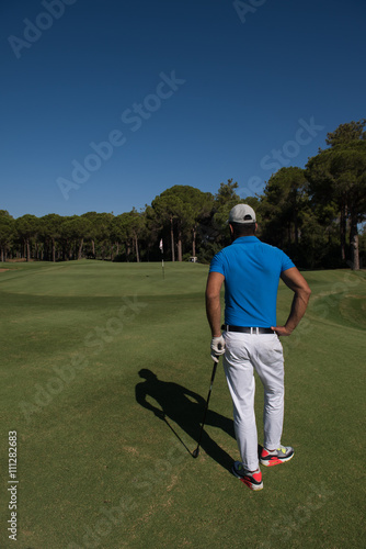 golf player portrait from back