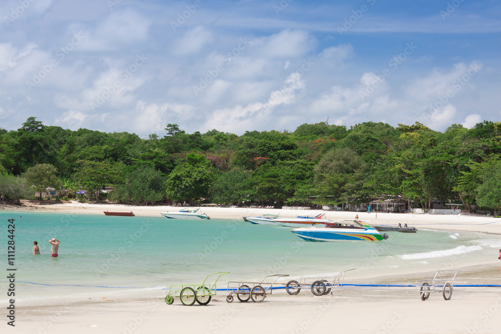 Beautiful sea landscape with tropical coast and the high-speed boat Beautiful sea landscape with tropical coast and the high-speed boat