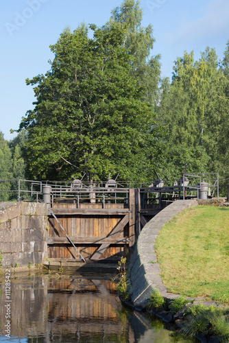Ancient wooden gate of the old lock "Mustola" in the Saimaa Canal. Finland