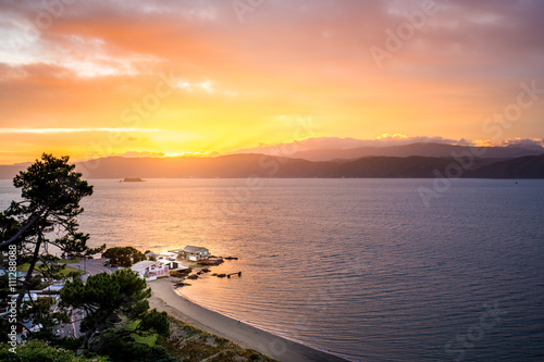 Sunrise from Seatoun Breaker Bay in Wellington, New Zealand photo