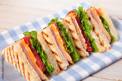 Club sandwich ham and cheese in a row