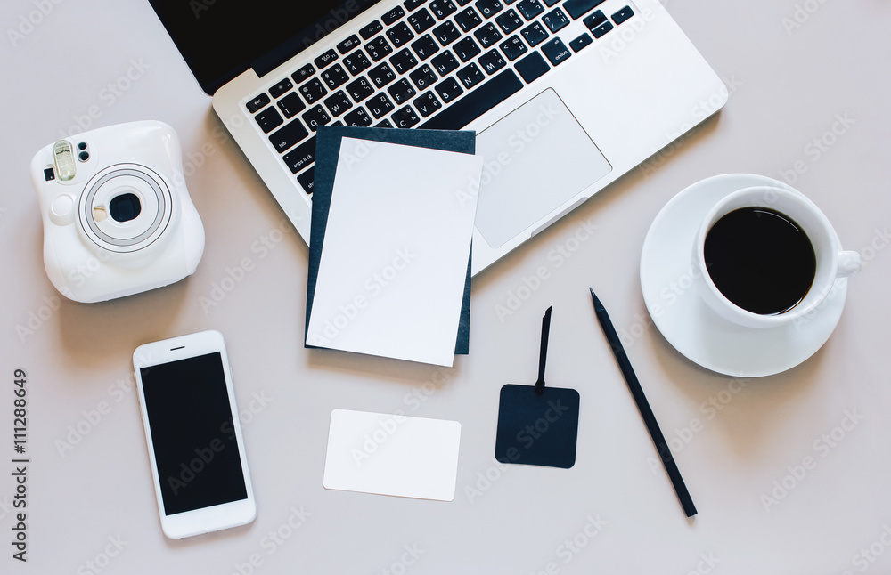 Creative flat lay photo of workspace desk with laptop, blank car Creative flat lay photo of workspace desk with laptop, blank car