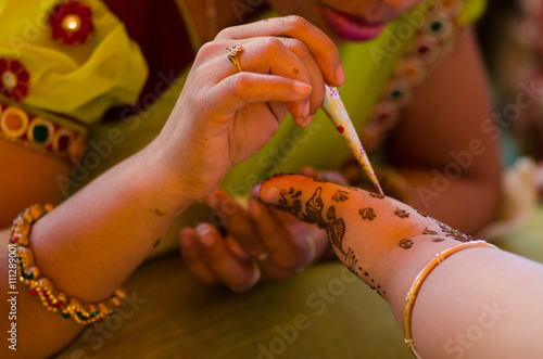 applying henna on hand, Hindu wedding ,Rajasthan, India