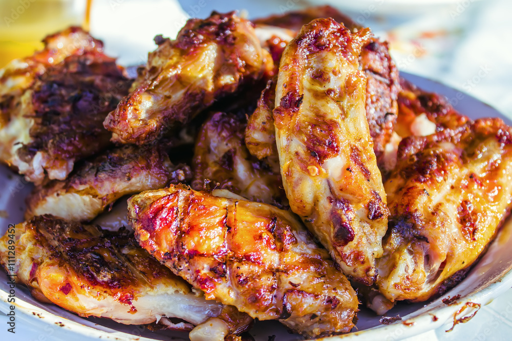 chef grilling lamb ribs on flame