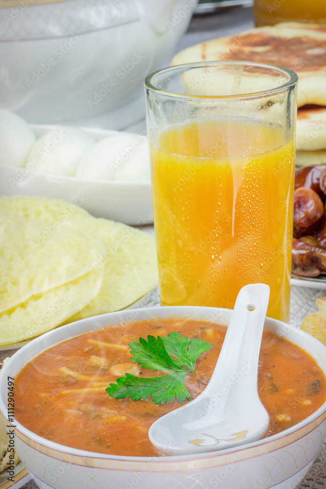 Bowl of Moroccan harira soup,chebakia, dates for iftar Bowl of Moroccan harira soup,chebakia, dates for iftar