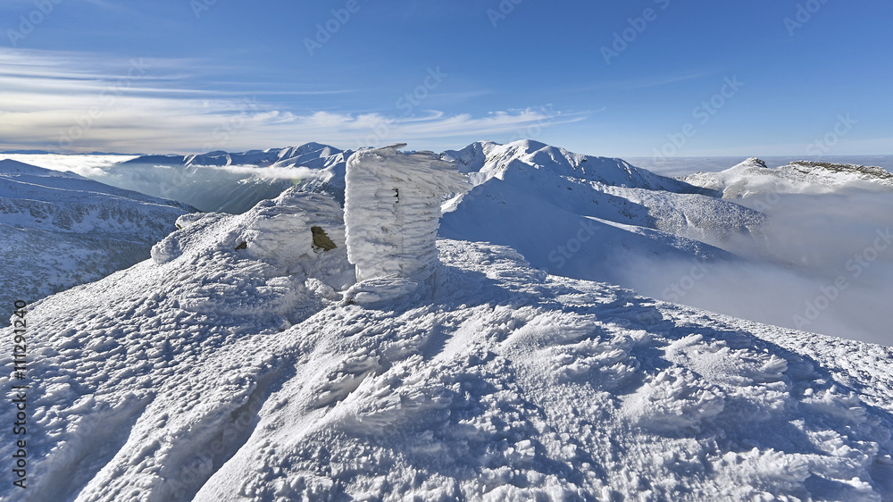 Winter panorama of mountains above the clouds. View of the High Tatras, nature