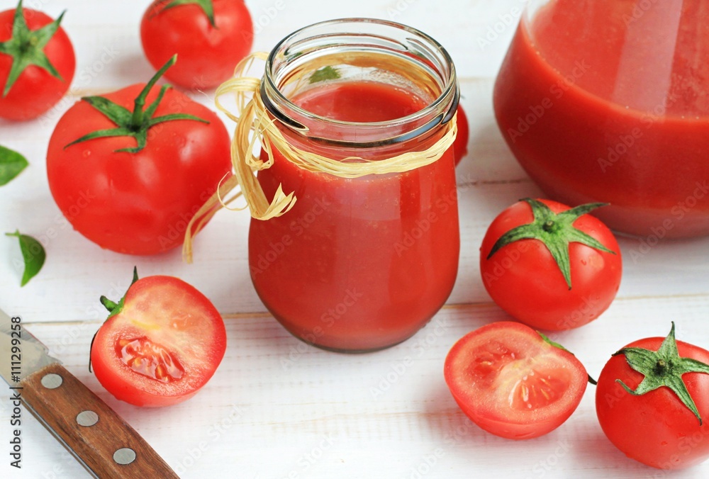 Fresh homemade tomato juice in glass jar, delicious healthy snack Fresh homemade tomato juice in glass jar, delicious healthy snack