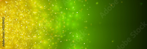 sparkling golden glitter in front of a dark green and yellow background (3D illustration) 