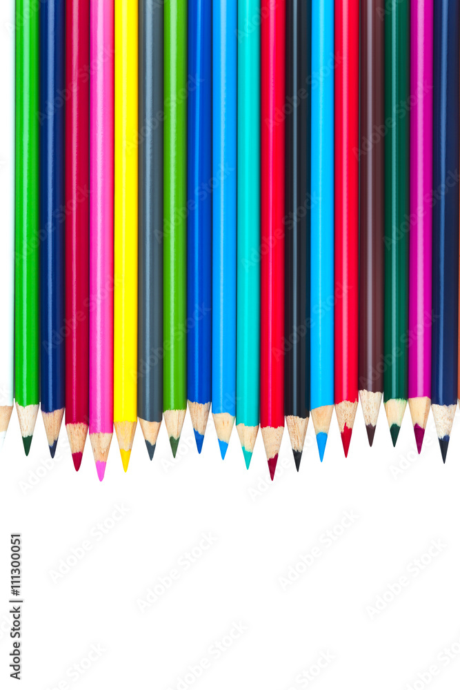 close-up shot of colored pencil arranged in a row over white. close-up shot of colored pencil arranged in a row over white.