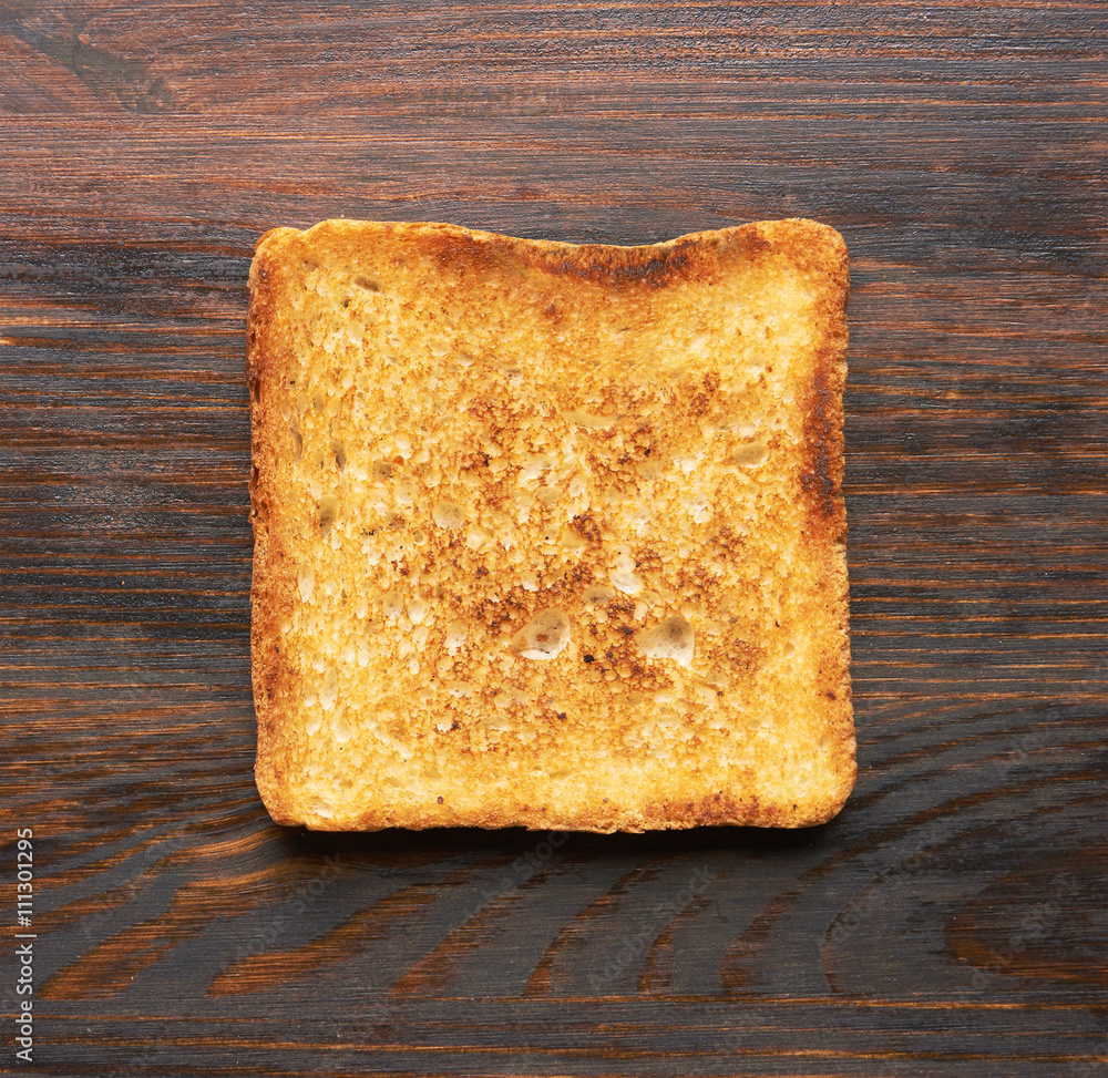 Toasts on wooden background