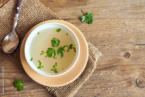Photography Chicken broth with parsley