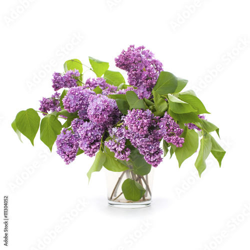 Large bouquet of lilacs in a glass vase..