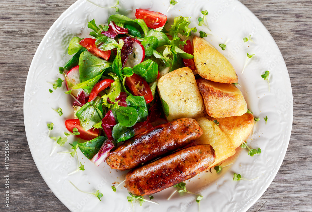 Roasted Sausages with Chips and Mix Vegetable salad Roasted Sausages with Chips and Mix Vegetable salad