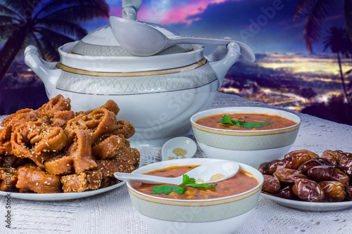Bowl of Moroccan harira soup,chebakia, dates for iftar