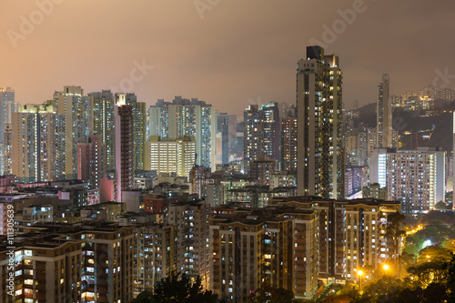 Hong Kong apartment building at night © leungchopan