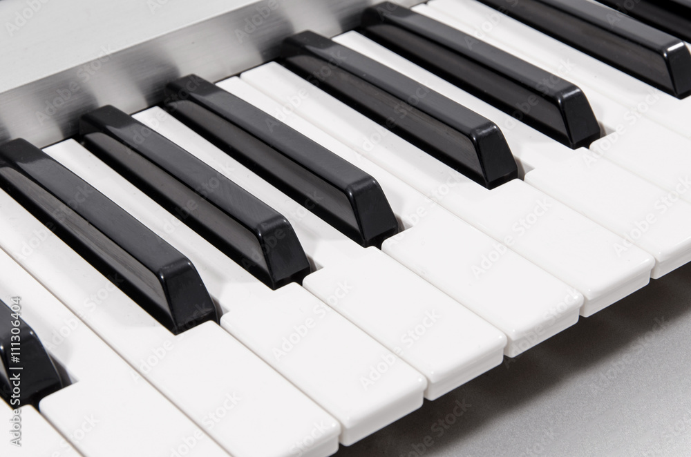closeup of modern electric piano keys in metallic casing closeup of modern electric piano keys in metallic casing