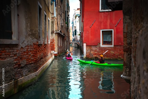 Venice, Italy - 19 September 2015: View of tourists rowing kayaks © Alexey Usachev