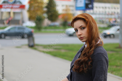 red-haired girl in autumn jacket