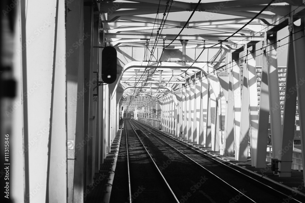 Fototapeta premium railroad : a track or set of tracks made of steel rails along wh