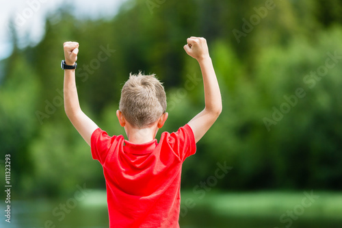 Kid with raised hands