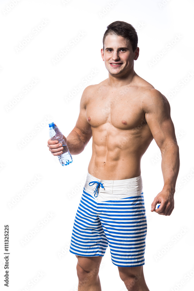 Fitness man holding a bottle of fresh water isolated over white background Fitness man holding a bottle of fresh water isolated over white background