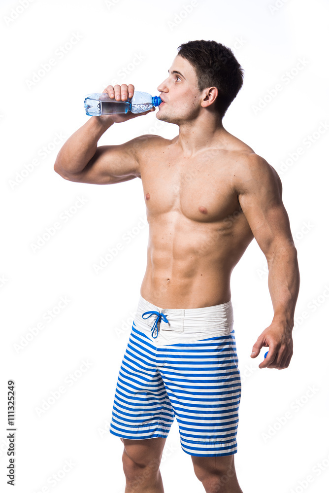Fitness man holding a bottle of fresh water isolated over white background Fitness man holding a bottle of fresh water isolated over white background