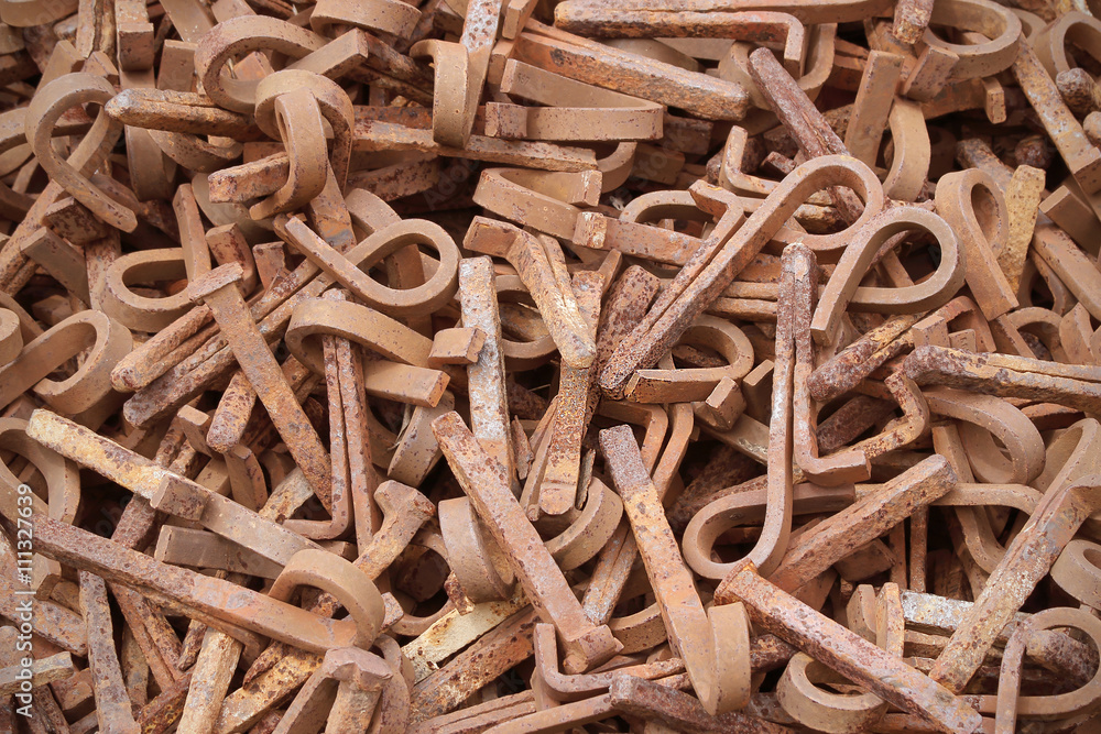 Pile of scrap metal spikes from railway construction