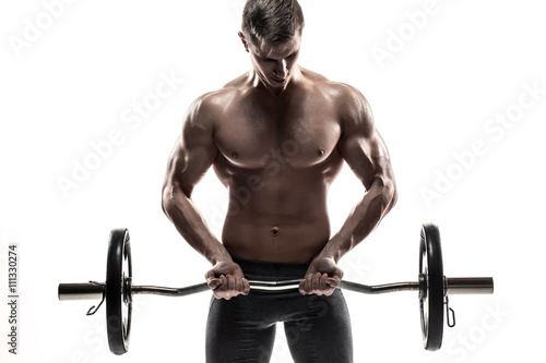 Young handsome man with naked torso and barbell