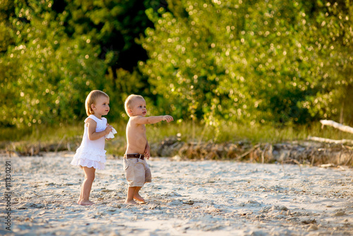 twins walking on the beach