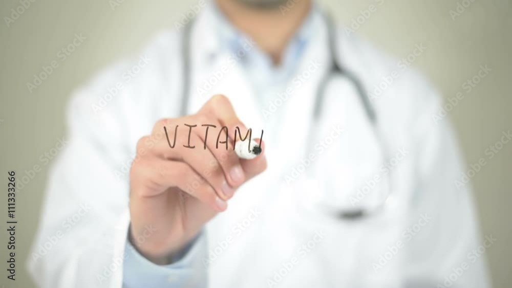 Vitamin C , Doctor writing on transparent screen Vitamin C , Doctor writing on transparent screen