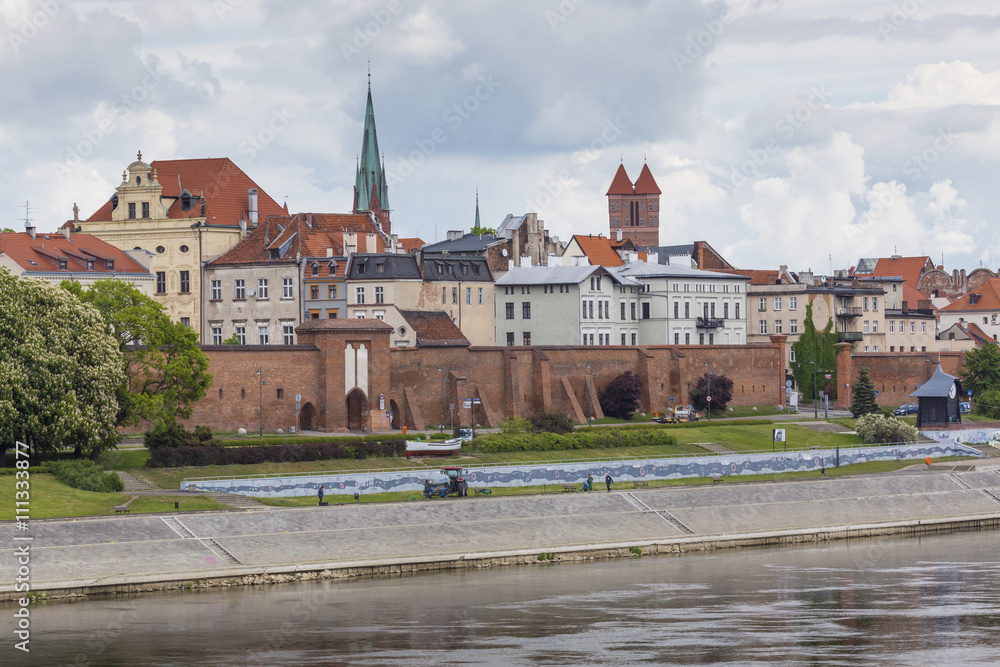 Torun in Poland, Old Town skyline, fortified medieval city, river view.