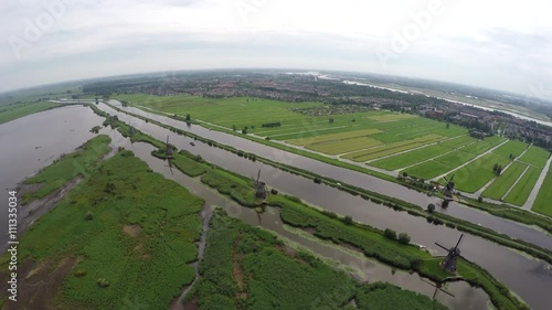 Aerial view Kinderdijk Childrens Dike flying over water and windmills Unesco World Heritage Unique Dutch sight and the most popular tourist attraction in Holland The Netherlands exists of 17 mills 4k photo