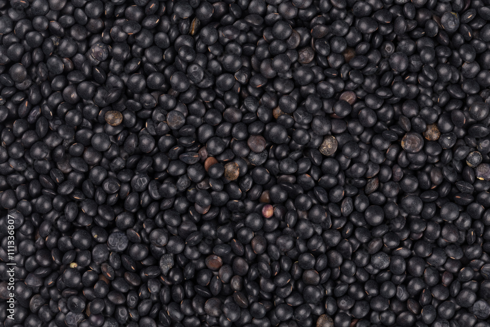 black lentils background closeup black lentils background closeup