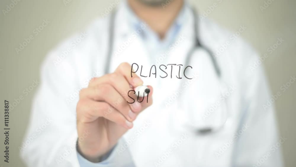 Plastic Surgery , Doctor writing on transparent screen Plastic Surgery , Doctor writing on transparent screen