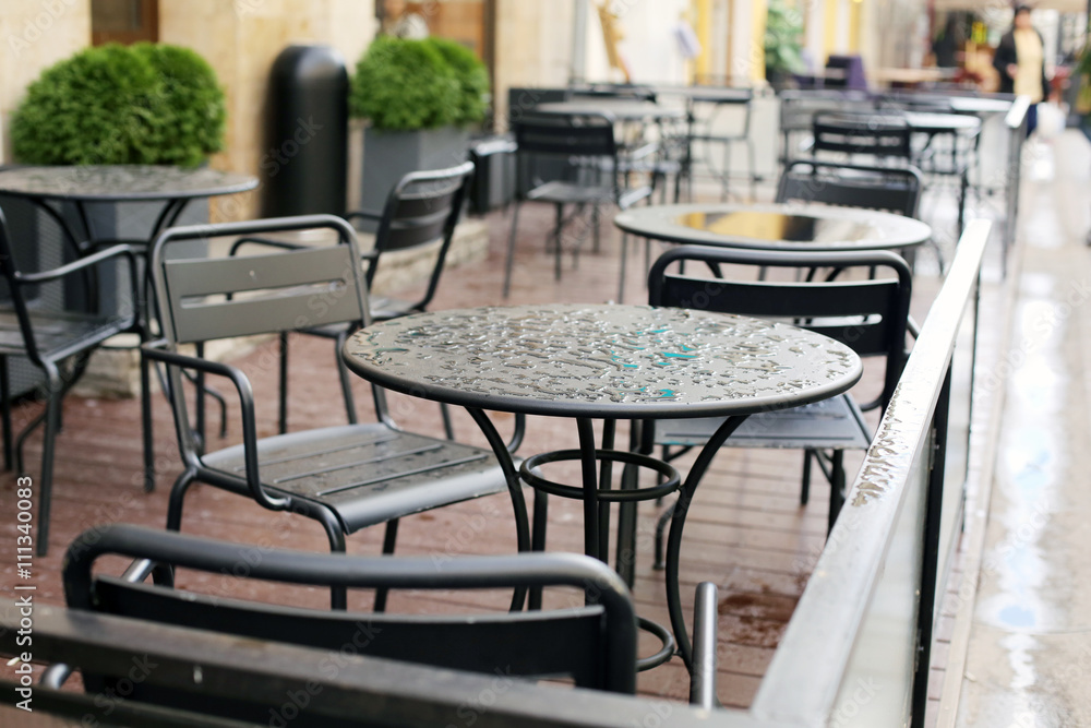 Fototapeta premium Summer street cafe after rain