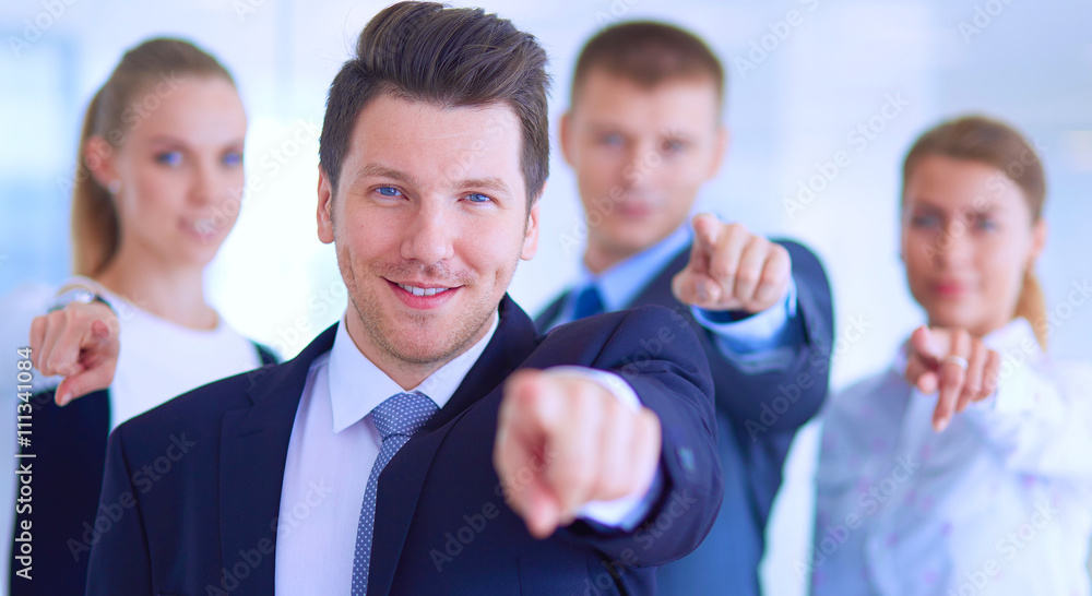 Group of business people pointing to you Group of business people pointing to you