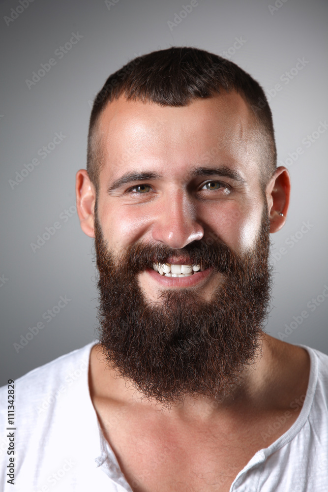 Portrait of handsome man standing, isolated on grey background Portrait of handsome man standing, isolated on grey background