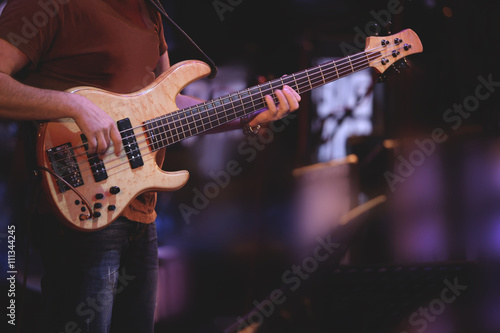 Guitarist playing the guitar at concert