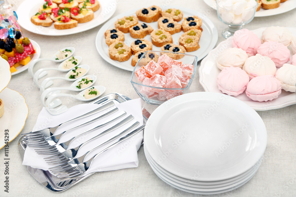 Set of cold snacks, canape and dessert, closeup Set of cold snacks, canape and dessert, closeup