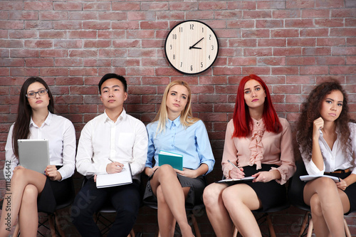 Young people sitting on a c...