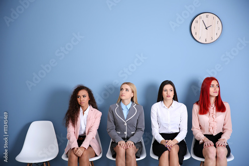 Young businesswomen sitting...