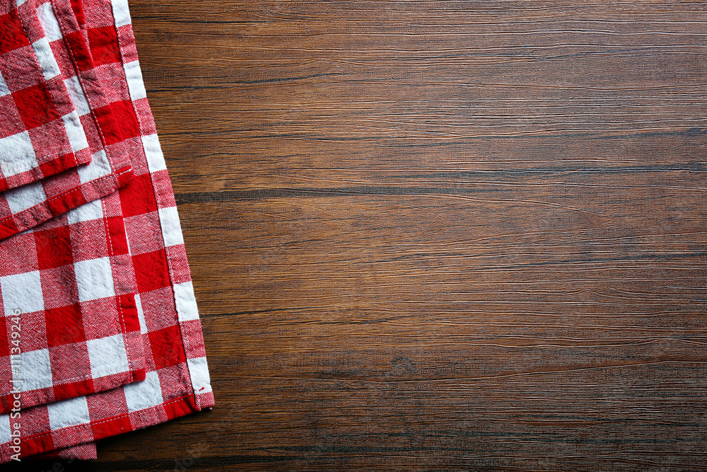 Obraz premium Checkered napkin on wooden background