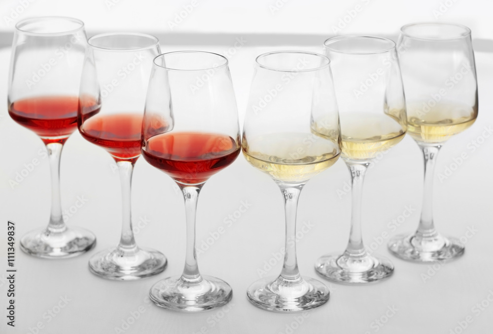Wine glasses with red and white wine, closeup Wine glasses with red and white wine, closeup
