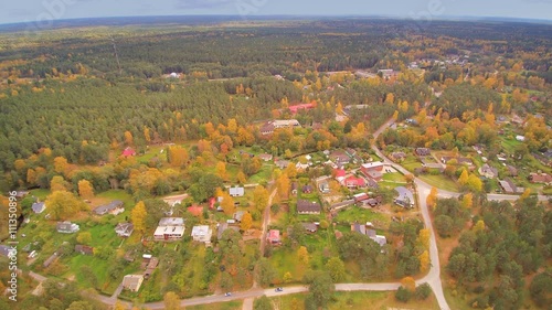 The aerial view of the town of Vosu with lots of trees surrounding the houses in Lahemaa Park photo