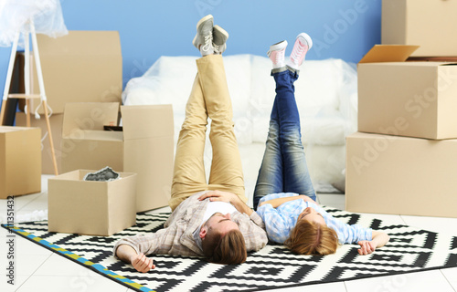 Happy young couple moving i...