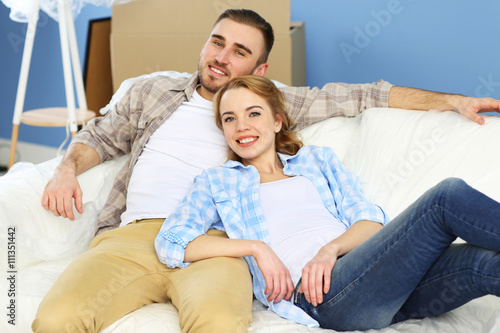 Happy young couple moving i...