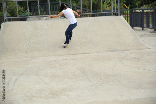 freeline skateboarder riding on freeline at skatepark photo