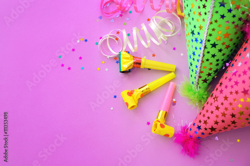 Party hats on pink background © Africa Studio