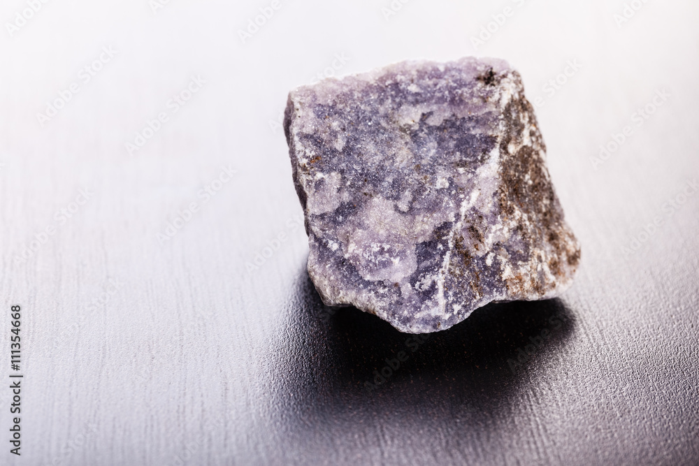lepidolite stone on wood lepidolite stone on wood