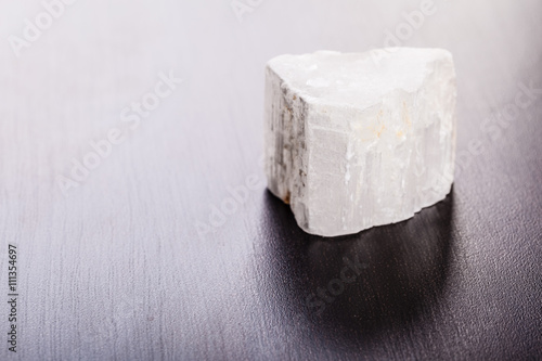selenite stone on wood photo
